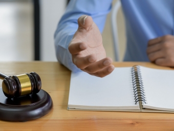 Close-up shot of Hammer on the table and lawyer introducing law, Concept of law.