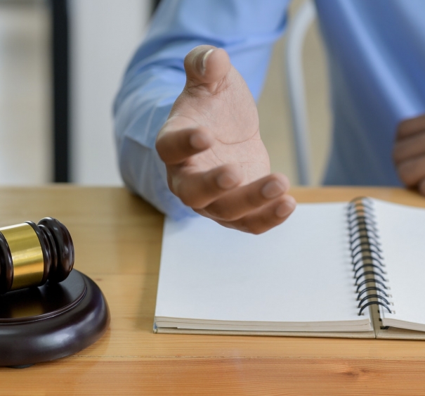 Close-up shot of Hammer on the table and lawyer introducing law, Concept of law.