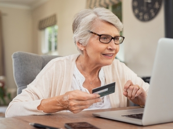 Old woman paying bills online