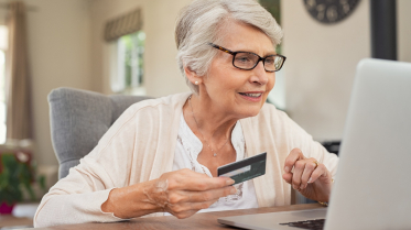 Old woman paying bills online