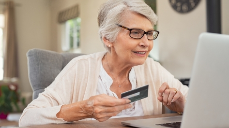 Old woman paying bills online